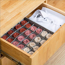 Foldable storage box for organizing ties and belts.