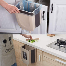 Collapsible hanging trash can for kitchen cabinet.