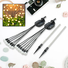 Solar garden lights with firefly design, warm light