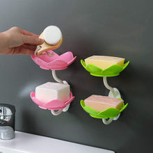 Flower-shaped self-draining soap dish holder for bathroom or kitchen use.