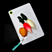 Plastic cutting board, ideal for chopping veggies and fruits