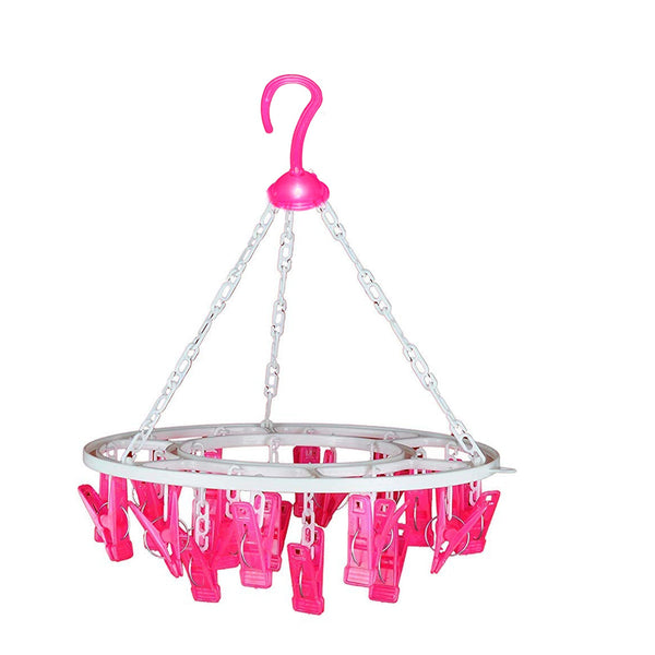 Round drying stand with 24 multicolour clips for hanging clothes.